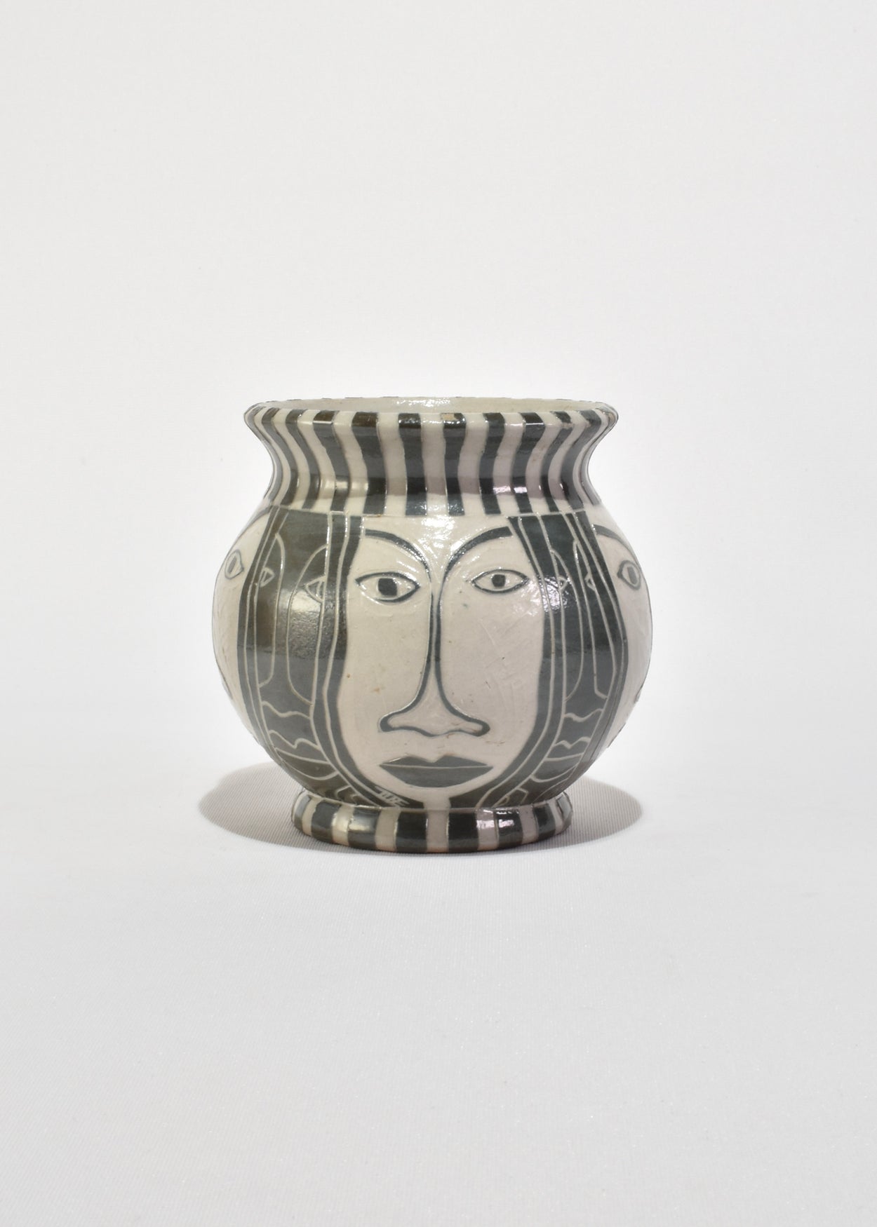 Face Motif Ceramic Vessel